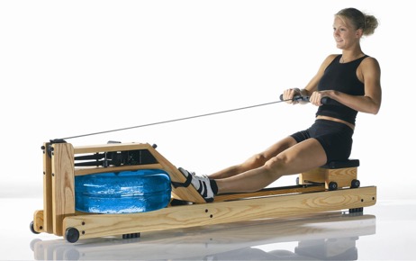Picture of a woman using a rowing machine - a great tool for weight loss
