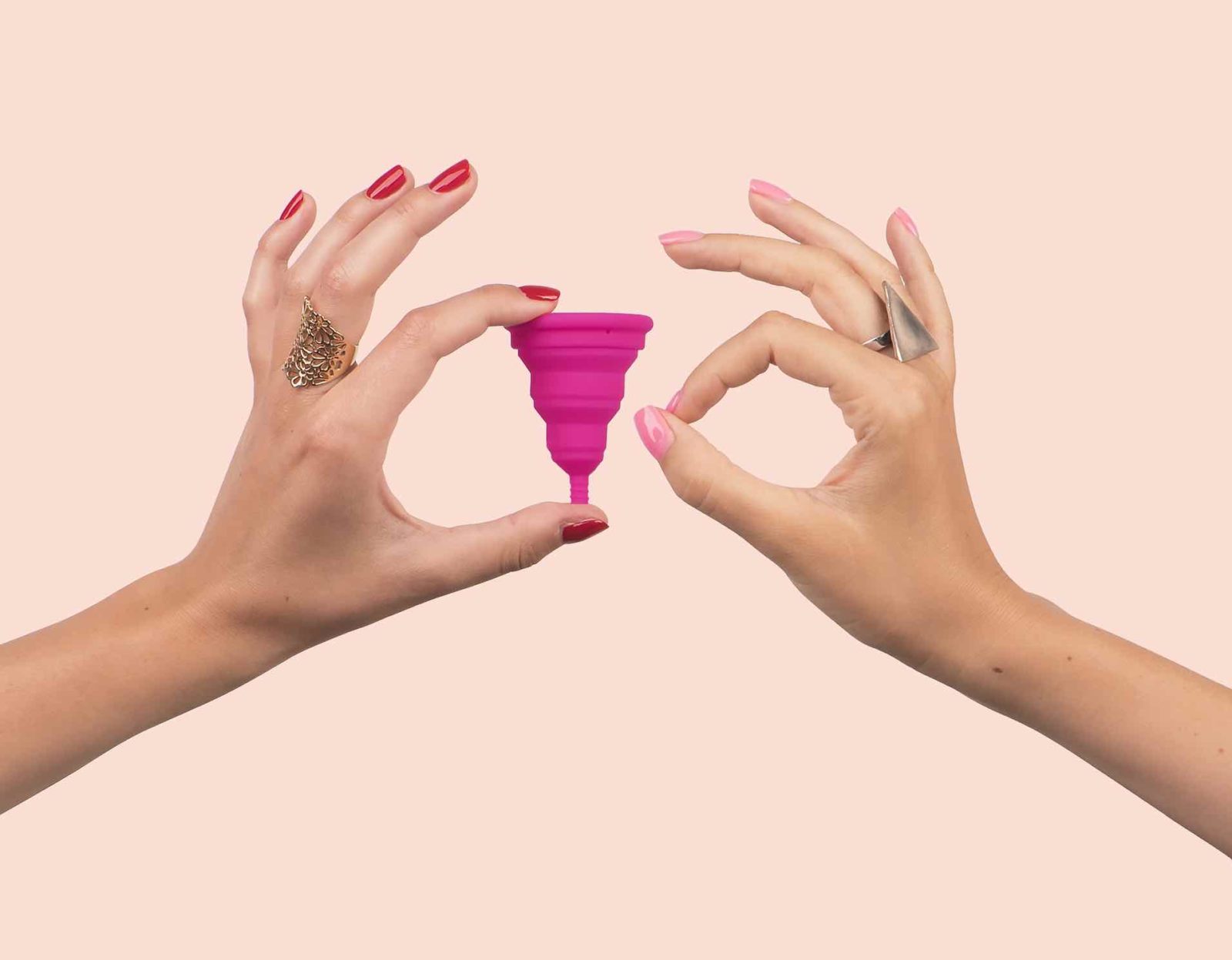 Picture of someone holding a menstrual cup