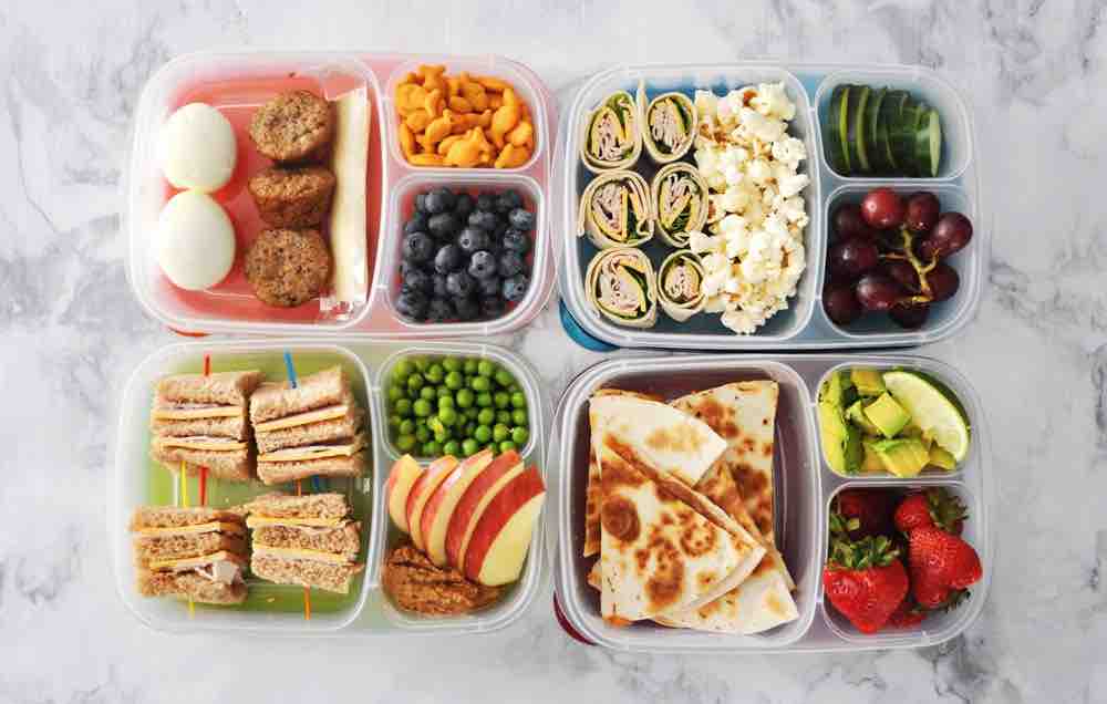 Picture of four lunches in a meal prep container